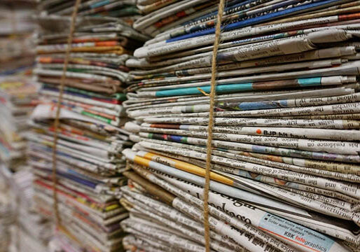 newspapers folded piles